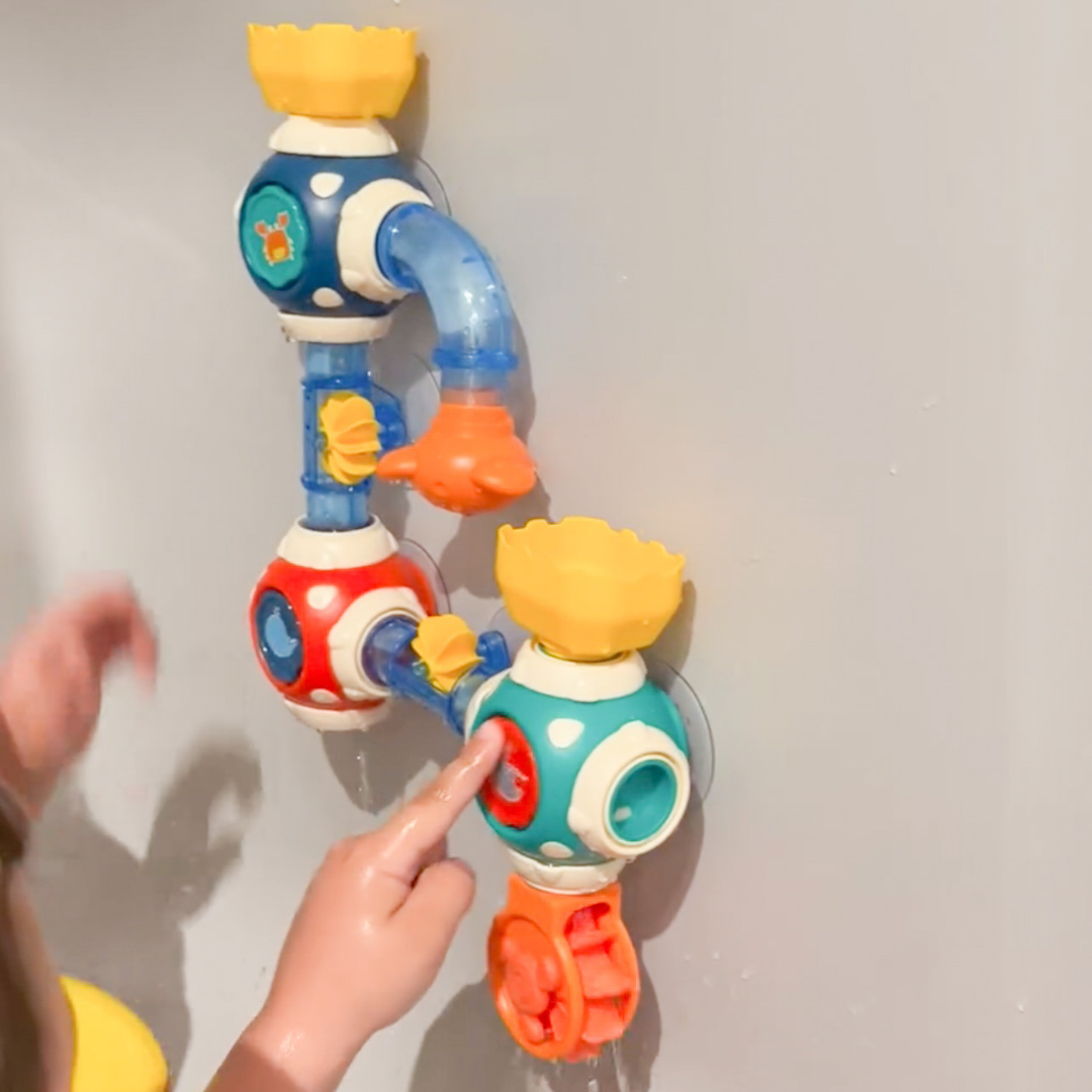 Child playing with Discovery Toys' Bath Pipes Toy