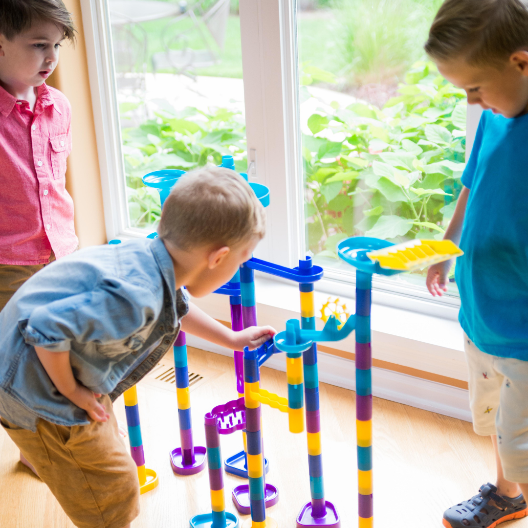 Kids playing with the ultimate marble run, marbleworks by Discovery Toys